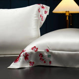 White Blossom Elegance: Pure Mulberry Silk Pillowcase with Red Floral Embroidery